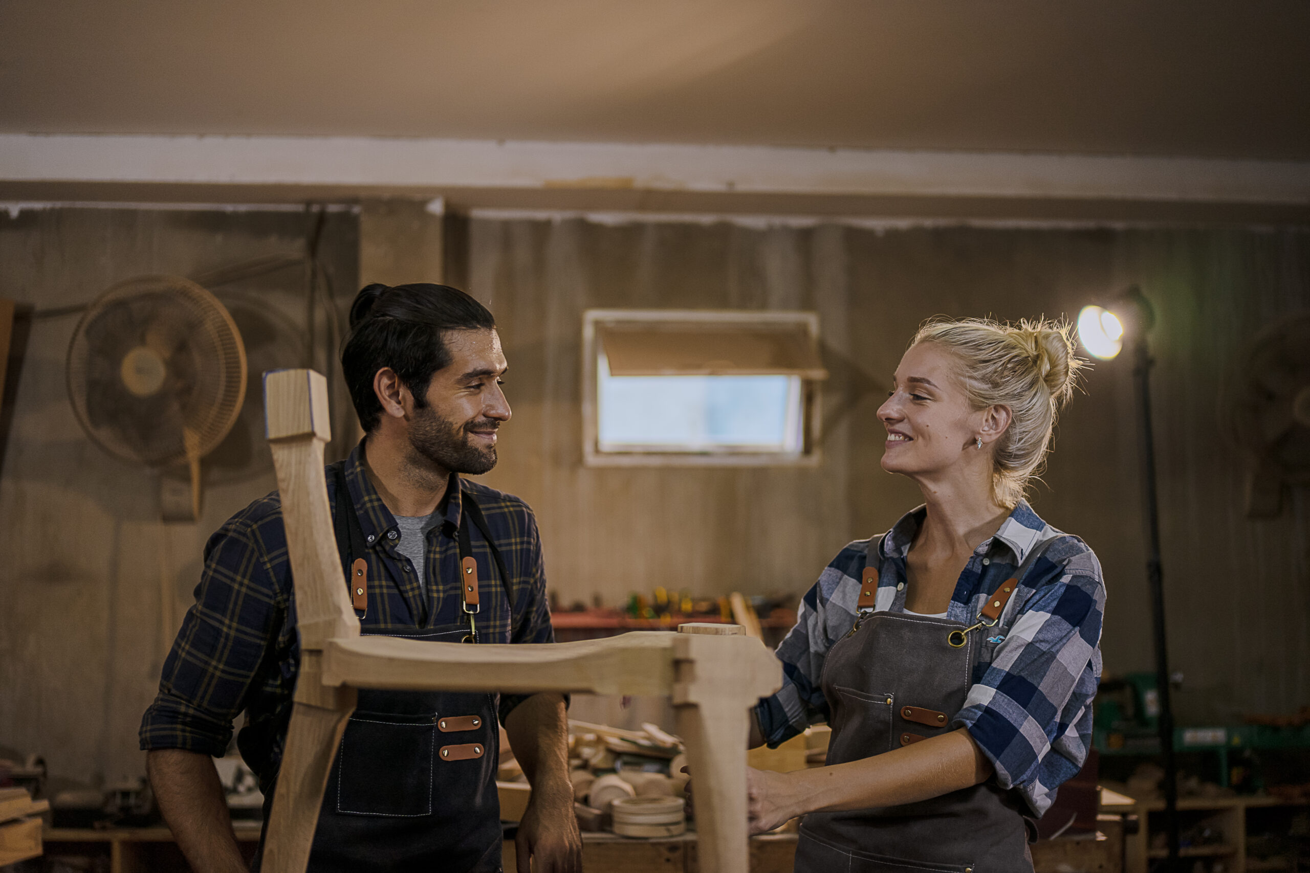 2 carpenters are glad they completed wood chair for kids